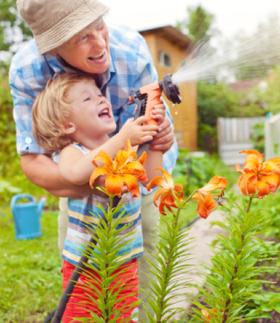 Grandparent and grandchild gardening together