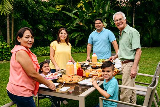 Multi-generational family enjoying a dinner outside